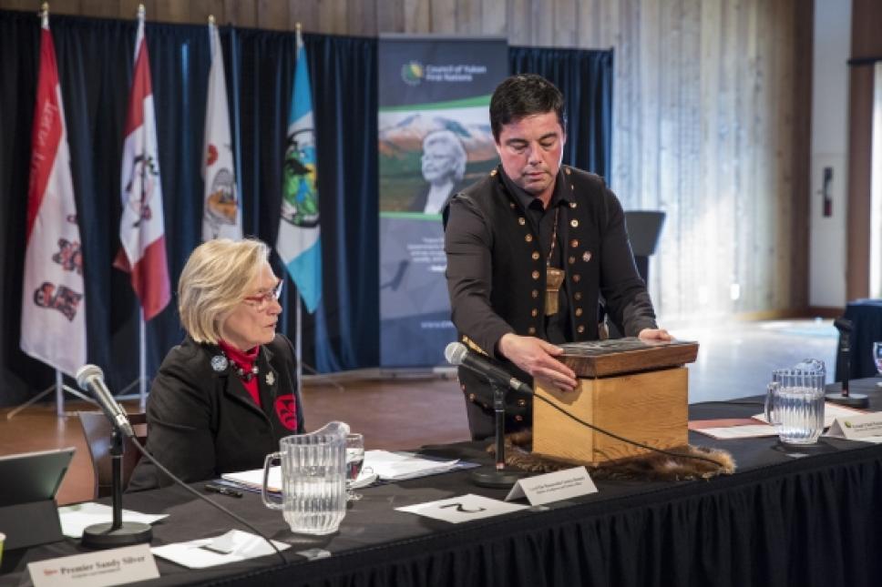 Council of Yukon First Nations Grand Chief Peter Johnson presents symbolic gift to federal Minister of Indigenous and Northern Affairs Carolyn Bennett at the Intergovernmental Forum.