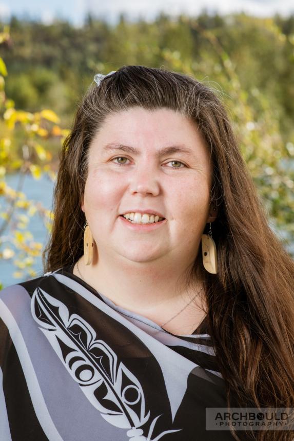 A close up of a woman with long brown hair