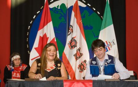 Georgina Sydney, negotiator and Peter Johnston, former Chief of Teslin Tlingit Council, sign the Administration of Justice Agreement in February 2011. 