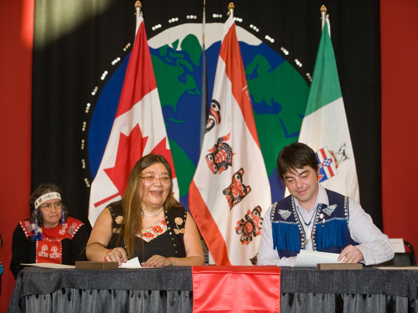 Georgina Sydney, negotiator and Peter Johnston, former Chief of Teslin Tlingit Council, sign the Administration of Justice Agreement in February 2011. 